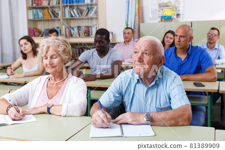 Mature man and woman take a written exam Mature man and woman take a written exam 81389909