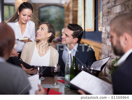 girl the waiter recommends dishes to guests girl the waiter recommends dishes to guests 81389964