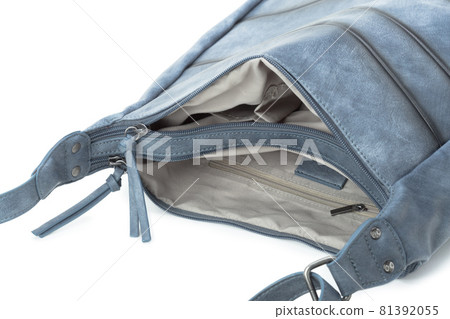 Capacious female purse handbag over a white background 81392055