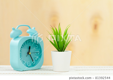 Alarm clock on wooden table close up Alarm clock on wooden table close up 81392544