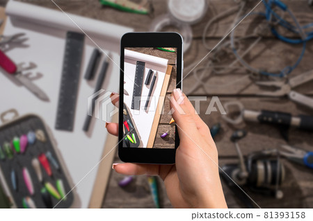 Fishing equipment with a cellphone. The photo is taken with telephone 81393158