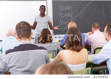 Young African American lecturer talking students 81393650