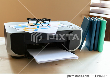 Close up of an office table with printer on it 81396616