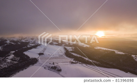 Sunset in the winter mountains landscape. Aerial view from above. 81396898