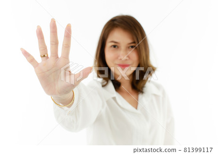 Portrait of Asian woman showing his five fingers for number 5 or prohibit, refuse manner. Selective focus on hand Portrait of Asian woman showing his five fingers for number 5 or prohibit, refuse manner. Selective focus on hand 81399117
