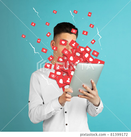 Addiction to social media. Young man attacked by notifications Addiction to social media. Young man attacked by notifications 81399172