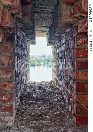 Observation window in the brick wall of the fortress for firing a gun with Observation window in the brick wall of the fortress for firing a gun with 81399980