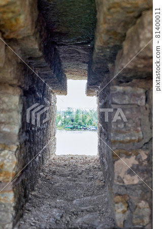 Observation window in the brick wall of the fortress for firing a gun with Observation window in the brick wall of the fortress for firing a gun with 81400011