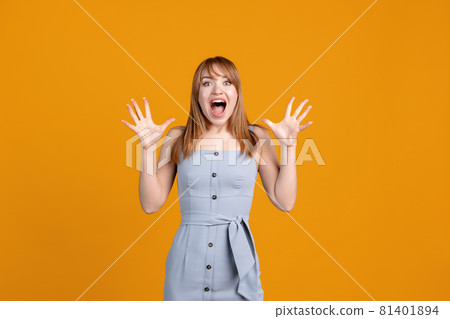 Horizontal portrait of young beautiful girl isolated on yellow studio background. Concept of human emotions, facial expression, youth, sales, ad. Horizontal portrait of young beautiful girl isolated on yellow studio background. Concept of human emotions, facial expression, youth, sales, ad. 81401894
