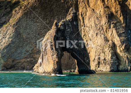 The Republic of Crimea. July 21, 2021. A picturesque view in sunny weather of the Golden Gate rock at the foot of the Kara-Dag mountain near the city of Koktebel. 81401956