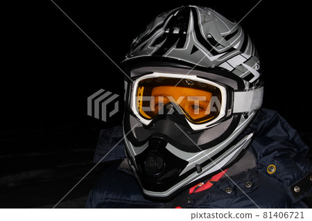 Child Wearing an ATV Helmet at Night Child Wearing an ATV Helmet at Night 81406721