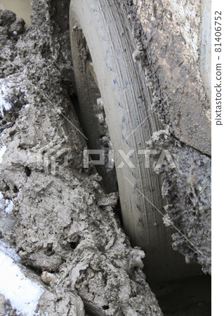 Closeup of a vehicle sinking in mud 81406752