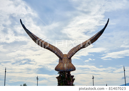 A sculpture of a red eagle spreading its wings. Popular tourist spot on Langkawi island 81407023