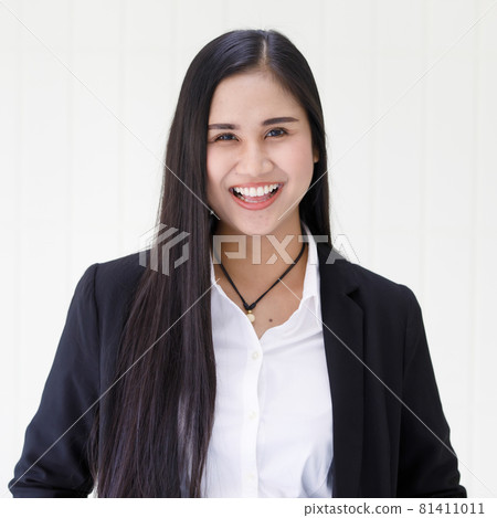 half body shot of young beautiful and happy Asian woman wearing smart casual smiling with friendly and happy face standing over white background. Confident businesswoman concept 81411011