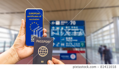 EU Digital Covid vaccination certificate or vaccine passports  on mobile phone. 81411018
