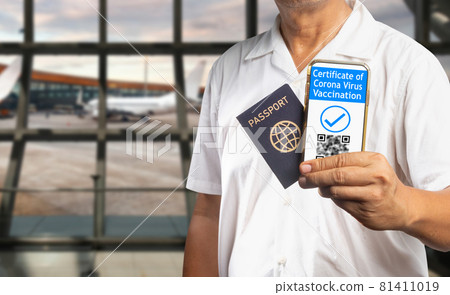 Digital Covid vaccination certificate or vaccine passports  on mobile phone. 81411019