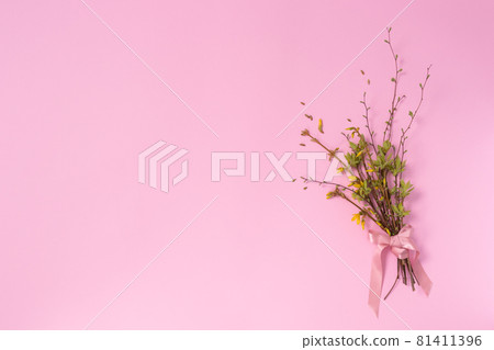 Spring bouquet from twigs with first leaves and flowers. Copy space. Spring bouquet from twigs with first leaves and flowers. Copy space. 81411396