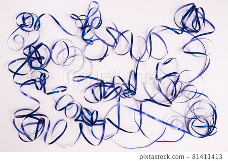 Shiny curly blue ribbon. Serpentine background. On a white. Shiny curly blue ribbon. Serpentine background. On a white. 81411413
