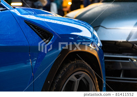parking problem. two cars stand close to each other with hoods 81411552