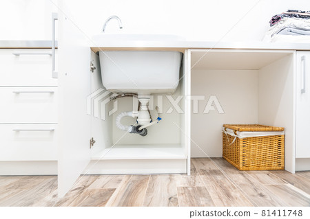 Under the sink view in laundry room 81411748