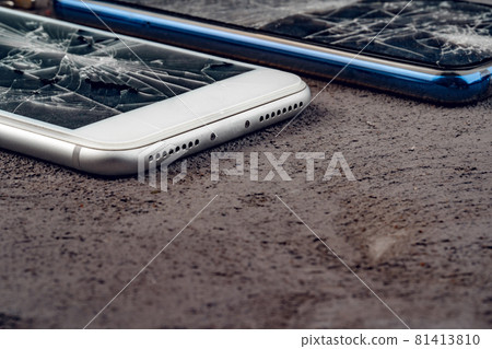 Mobile smartphone with broken screen close up Mobile smartphone with broken screen close up 81413810