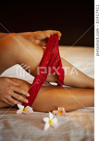 Female lower body in red underwear Female lower body in red underwear 81417411