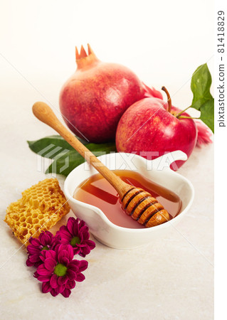 Rosh hashanah, jewish New Year holiday. Concept of traditional or religion symbols on travertine stone background Rosh hashanah, jewish New Year holiday. Concept of traditional or religion symbols on travertine stone background 81418829