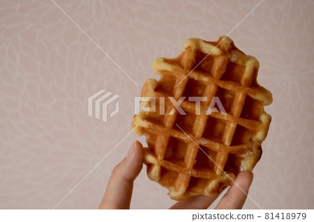A delicious waffle in your hand A delicious waffle in your hand 81418979