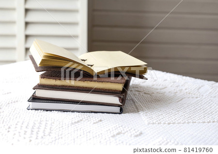 Stacked books and notebooks Stacked books and notebooks 81419760