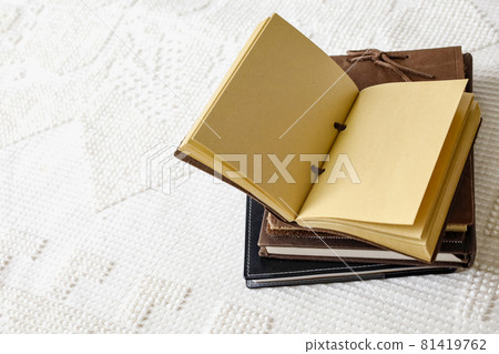 Stacked books and notebooks 81419762