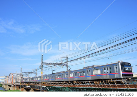 Keisei Electric Railway 3000 series train running fast on the Arakawa Bridge in fine weather Keisei Electric Railway 3000 series train running fast on the Arakawa Bridge in fine weather 81421106