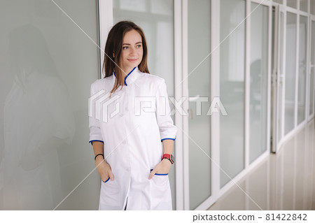 Portrait of a female doctor stand bright modern hospital. medecine concept 81422842