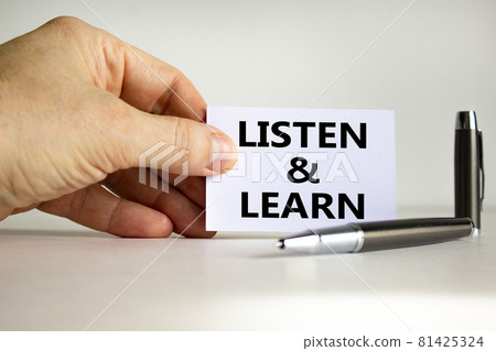 Listen and learn symbol. White paper with words 'Listen and learn' in businessman hand, metallic pen. Beautiful white background. Business, educational and listen and learn concept. Copy space. Listen and learn symbol. White paper with words 'Listen and learn' in businessman hand, metallic pen. Beautiful white background. Business, educational and listen and learn concept. Copy space. 81425324