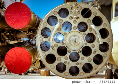 Closeup of rocket launchers of a military helicopter Closeup of rocket launchers of a military helicopter 81425333