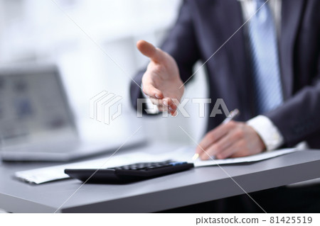 close up. investor extending his hand to business partner close up. investor extending his hand to business partner 81425519