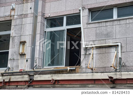 Building demolition work: A window discharging the removed waste Building demolition work: A window discharging the removed waste 81428433