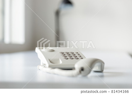 White landline telephone with handset off line White landline telephone with handset off line 81434166