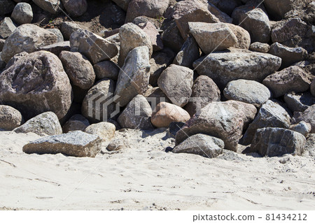 Rockfall on the road in the mountains. Stones of different sizes. Landslides. Rockfall on the road in the mountains. Stones of different sizes. Landslides. 81434212