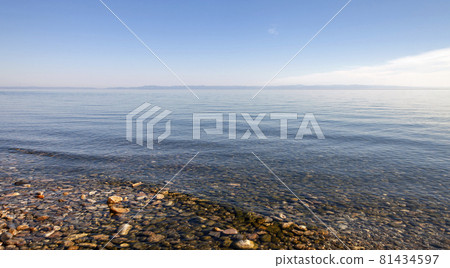 Clear fresh water and panorama of Lake Baikal on summer day. Clear fresh water and panorama of Lake Baikal on summer day. 81434597
