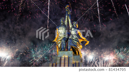 Celebratory colorful fireworks and soviet monument Rabochiy i Kolkhoznitsa ( Worker and Kolkhoz Woman or Worker and Collective Farmer) of sculptor Vera Mukhina, Moscow, Russia. Made of in 1937 81434705