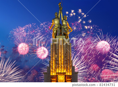 Celebratory colorful fireworks and soviet monument Rabochiy i Kolkhoznitsa ( Worker and Kolkhoz Woman or Worker and Collective Farmer) of sculptor Vera Mukhina, Moscow, Russia. Made of in 1937 81434731