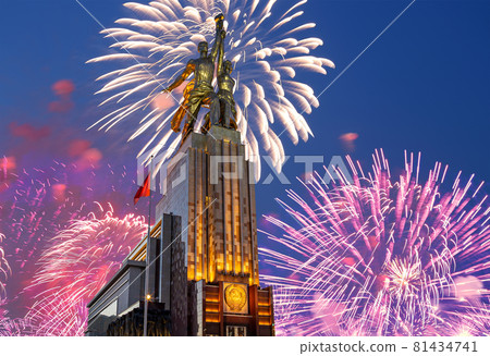 Celebratory colorful fireworks and soviet monument Rabochiy i Kolkhoznitsa ( Worker and Kolkhoz Woman or Worker and Collective Farmer) of sculptor Vera Mukhina, Moscow, Russia. Made of in 1937 81434741