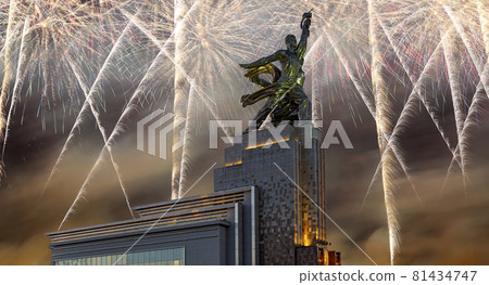 Celebratory colorful fireworks and soviet monument Rabochiy i Kolkhoznitsa ( Worker and Kolkhoz Woman or Worker and Collective Farmer) of sculptor Vera Mukhina, Moscow, Russia. Made of in 1937 Celebratory colorful fireworks and soviet monument Rabochiy i Kolkhoznitsa ( Worker and Kolkhoz Woman or Worker and Collective Farmer) of sculptor Vera Mukhina, Moscow, Russia. Made of in 1937 81434747