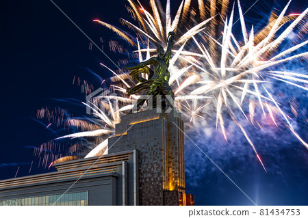 Celebratory colorful fireworks and soviet monument Rabochiy i Kolkhoznitsa ( Worker and Kolkhoz Woman or Worker and Collective Farmer) of sculptor Vera Mukhina, Moscow, Russia. Made of in 1937 81434753