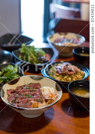 Steak Don, a Japanese dish consisting of a bowl of rice topped with rare beef with egg Steak Don, a Japanese dish consisting of a bowl of rice topped with rare beef with egg 81434811