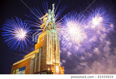 Celebratory colorful fireworks and soviet monument Rabochiy i Kolkhoznitsa ( Worker and Kolkhoz Woman or Worker and Collective Farmer) of sculptor Vera Mukhina, Moscow, Russia. Made of in 1937 81434929