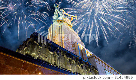 Celebratory colorful fireworks and soviet monument Rabochiy i Kolkhoznitsa ( Worker and Kolkhoz Woman or Worker and Collective Farmer) of sculptor Vera Mukhina, Moscow, Russia. Made of in 1937 81434999