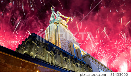 Celebratory colorful fireworks and soviet monument Rabochiy i Kolkhoznitsa ( Worker and Kolkhoz Woman or Worker and Collective Farmer) of sculptor Vera Mukhina, Moscow, Russia. Made of in 1937 81435000