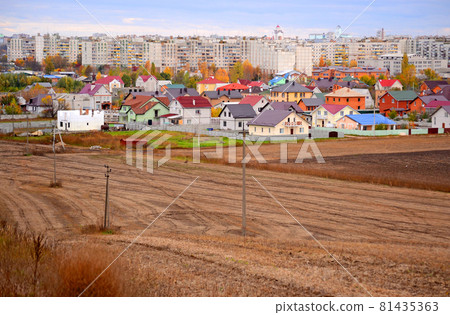 plowed field and at home on a cloudy day 81435363