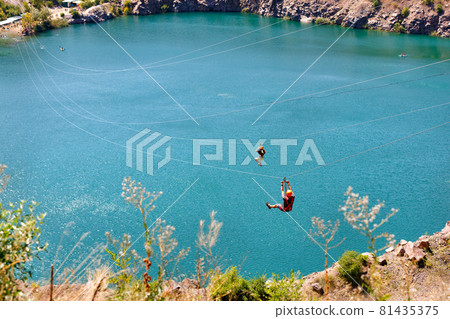 A zipline cable car across a radon lake near the village of Migia, Ukraine, has emerged on the site of an old granite quarry. 81435375